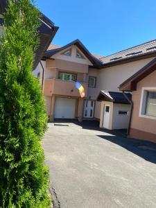 a house with a kite in the driveway at Casa Jeni in Suceava