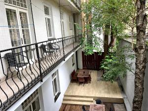an empty balcony of a building with a table and chairs at Hostel Waltz in Bratislava
