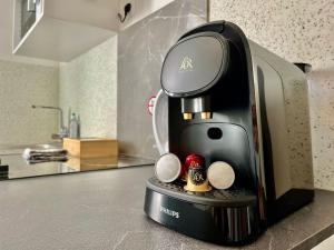 a coffee maker sitting on top of a kitchen counter at Studio 4 Rue Théodore Bac - DABNB in Limoges