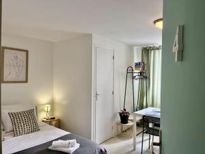 Ένα ή περισσότερα κρεβάτια σε δωμάτιο στο Studio 4 Rue Théodore Bac - DABNB