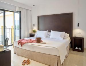 Posteľ alebo postele v izbe v ubytovaní Hotel Rey Alfonso X