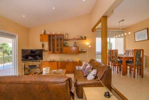a living room with a couch and a table at Club Villamar - Issei in Blanes
