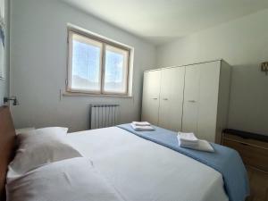 Ένα ή περισσότερα κρεβάτια σε δωμάτιο στο IseoLakeRental - Panorama House