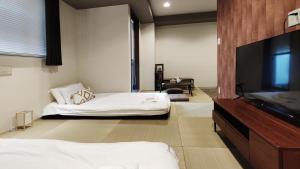 Televisyen dan/atau pusat hiburan di Leisurely Home · Namba 悠闲居·难波