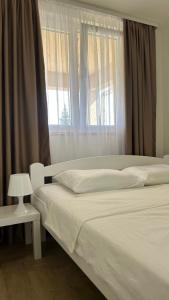 Postel nebo postele na pokoji v ubytování Apartmani Radmanovic