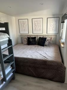 a bedroom with a bed with two pillows on it at Cottage with a view in Båstad