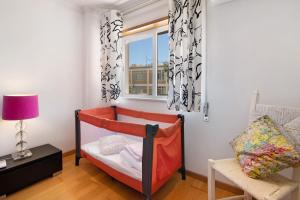Ένα ή περισσότερα κρεβάτια σε δωμάτιο στο Casa da Saudade no centro de Faro