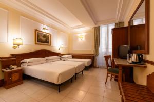 Postel nebo postele na pokoji v ubytování Hotel Hiberia