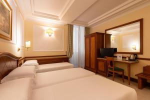 Postel nebo postele na pokoji v ubytování Hotel Hiberia
