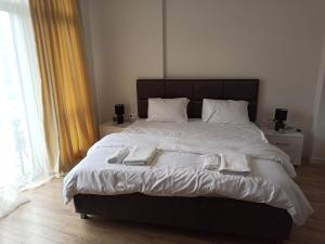 Ένα ή περισσότερα κρεβάτια σε δωμάτιο στο Coastal Breeze Apartment