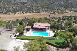 an aerial view of a house with a swimming pool at Lahtagas Estate with private swimming pool in Loutraki +51 photos
