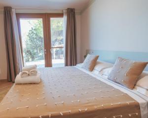 Postel nebo postele na pokoji v ubytování Agriturismo Rascioni & Cecconello