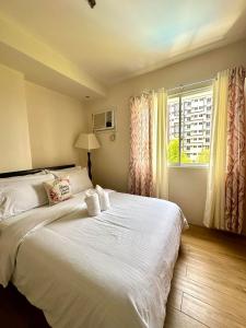 Postel nebo postele na pokoji v ubytování Matina Enclaves Residences