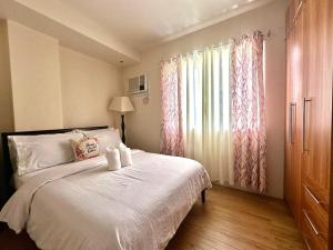 Postel nebo postele na pokoji v ubytování Matina Enclaves Residences