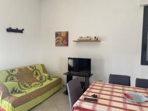 a living room with a couch and a table at Torre Lapillo in Torre Lapillo