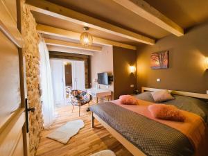 a bedroom with two beds and a living room at Holiday house Ivana, Zadar, Vinjerac in Vinjerac