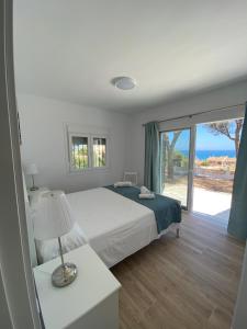 Postel nebo postele na pokoji v ubytování BEACH HOUSE EL BOSQUE