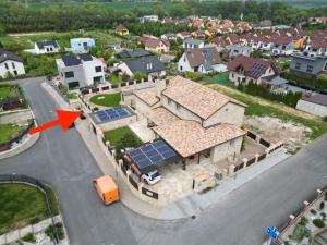 an aerial view of a house with solar panels on the roof at Prague West - Studio Chyne with Terrace in Chýně +21 photos