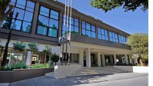 a large building with glass windows and stairs at Alasia Boutique Hotel in Limassol