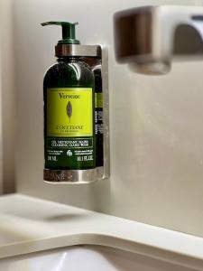 a bottle of soap sitting on top of a sink at Sentire Hotels & Residences Taksim in Istanbul