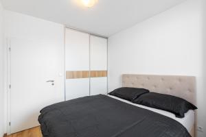 Ένα ή περισσότερα κρεβάτια σε δωμάτιο στο LEO apartment - AC & Free parking