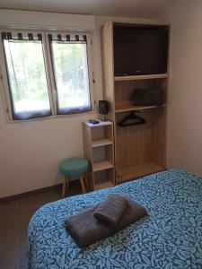 Łóżko lub łóżka w pokoju w obiekcie Gîte Nature et détente