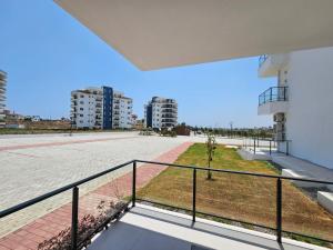 a view from the balcony of a building at Pompeius Beachside Retreat 2-Bedroom Apartment g-7 in Perivolia tou Trikomou