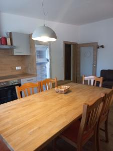 a wooden table in a kitchen with a bowl on it at Appartementhaus Römerhof Superior in Bad Kleinkirchheim