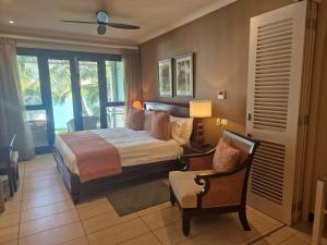 Ένα ή περισσότερα κρεβάτια σε δωμάτιο στο Porse Deluxe Suites by Simply-Seychelles +71 φωτογραφίες