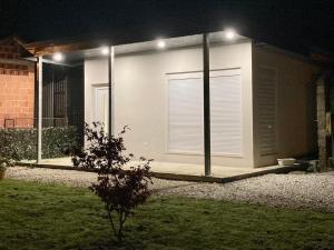 a house with a garage at night with lights at Studio apartman - herlla in Velika Gorica