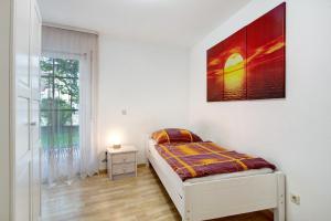 Postel nebo postele na pokoji v ubytování Ferienwohnung Ahorn