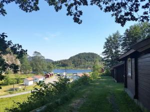 a view of a lake from a house at Svindland Camping in Kvinesdal +4 photos