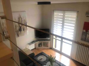 TV a/nebo společenská místnost v ubytování Casa Ambra, 50m vom Comer See, 2 private Parkplätze