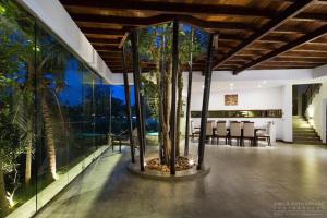 a house with a tree inside of it at Villa 47 Colombo in Pannipitiya