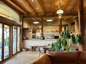 a living room with a couch and a table at La Ferme de Tart in Verdonnet