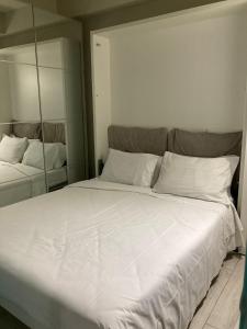Postel nebo postele na pokoji v ubytování Adalesia Hotel & Coffee