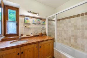 a bathroom with a sink and a shower at Casa San Giovanni 1 a Vinigo in Vinigo +21 photos