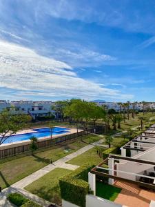 an overhead view of a swimming pool at a resort at Condado de Alhama, Jardin 7 in Alhama de Murcia