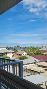 a view of a city from a balcony at Cosy SeaView, High Floor, free Netflix in Bangsaen +14 photos