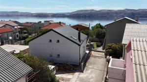 an aerial view of a city with a body of water at Sunshine apartments in Karlobag