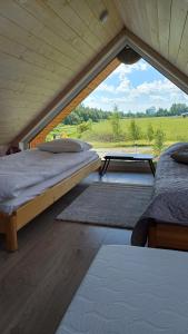 Postel nebo postele na pokoji v ubytování Pieni Mökki