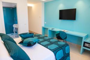 TV a/nebo společenská místnost v ubytování B&B Caporivo + 26 fotografií