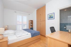 Posteľ alebo postele v izbe v ubytovaní Family Apartments Marita + 37 fotografií
