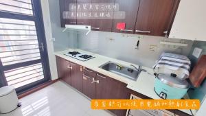 Eldhús eða eldhúskrókur á SUIIAN inn 隨緣民宿恆春小鎮內 國旅卡 可包棟