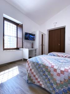 Postel nebo postele na pokoji v ubytování Le Tre Lune B&B