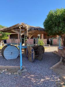 a large wooden barrel with a hut on top at Les cavaliers chez Yassine in Marrakesh +57 photos