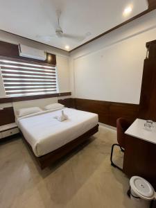 Welcome Hotels客房内的一张或多张床位