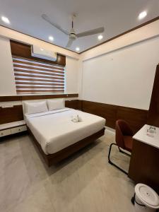 Welcome Hotels客房内的一张或多张床位