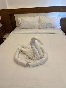 Welcome Hotels客房内的一张或多张床位