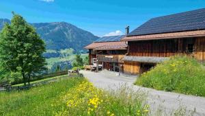 a barn with solar panels on the roof at Haus Mura in Blons